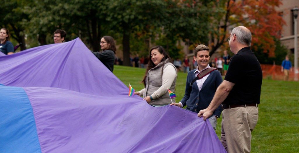 staff at an event on the lawn near Bascom Hall.